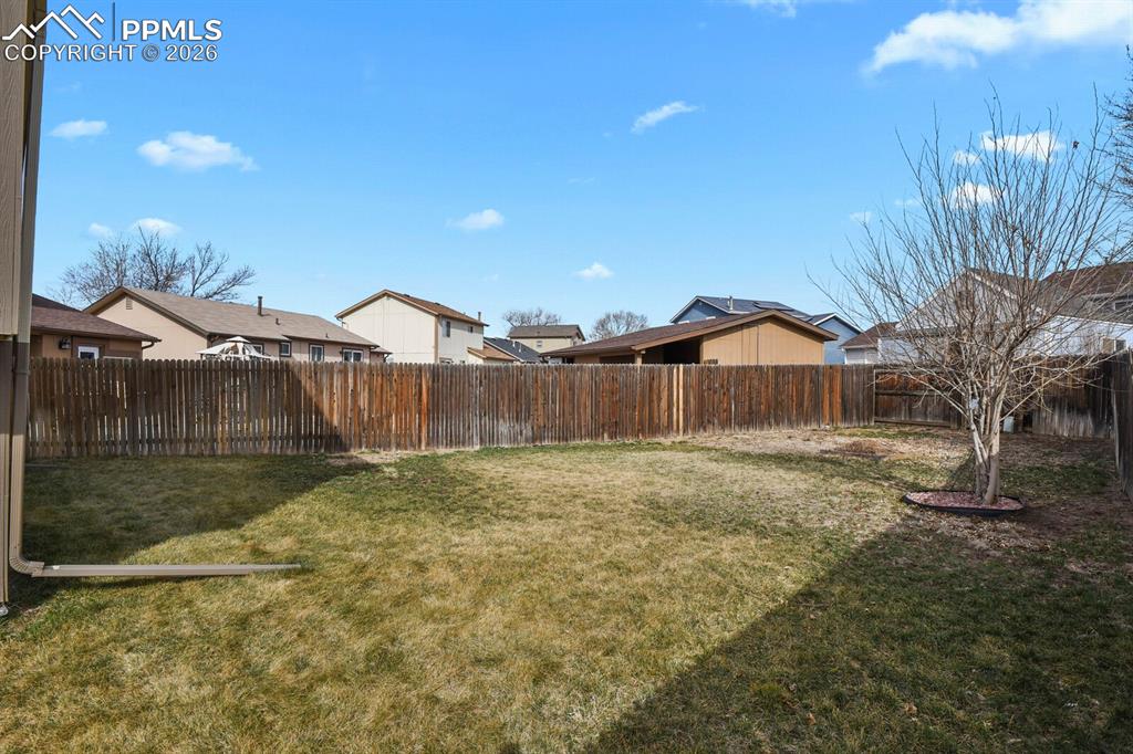 Image 31 of 32: Fenced backyard featuring a residential view