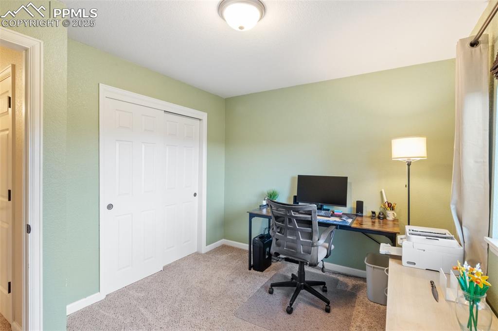Image 18 of 35: Office area featuring carpet flooring and baseboards