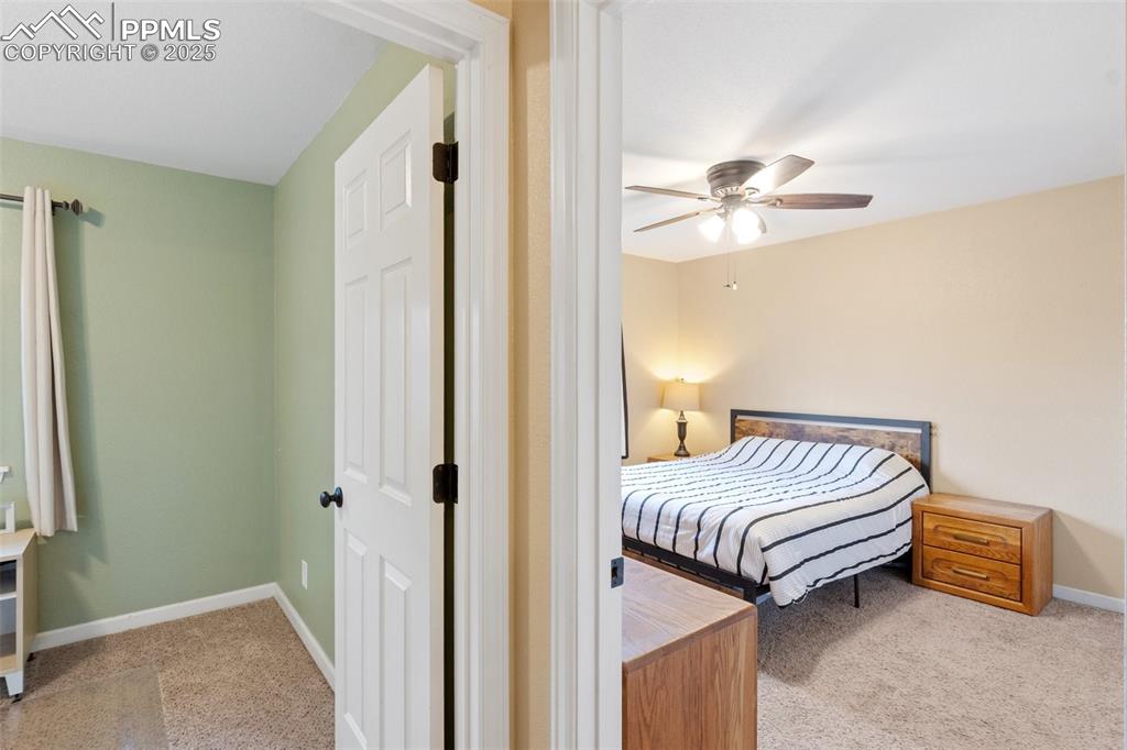 Image 26 of 35: Carpeted bedroom featuring baseboards and a ceiling fan