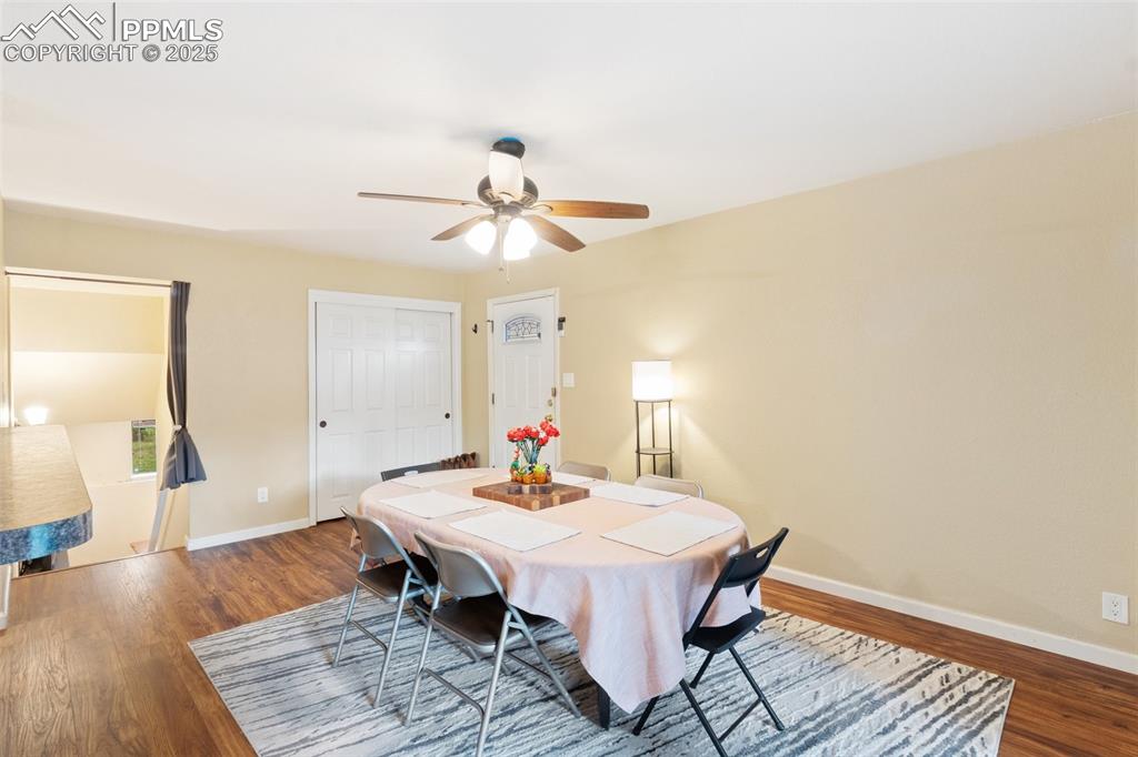 Image 6 of 35: Dining space featuring ceiling fan and wood finished floors