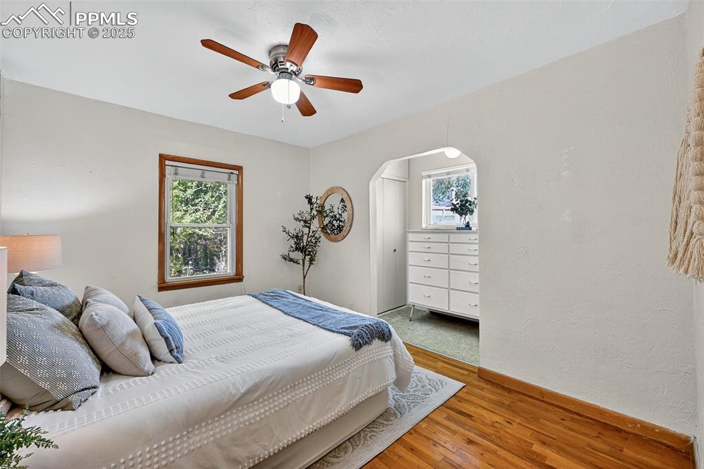 Image 16 of 46: Primary bedroom main level View towards closet and built in dresser