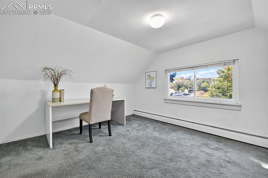 Image 19 of 46: 3rd bedroom Upper Level staged as an office