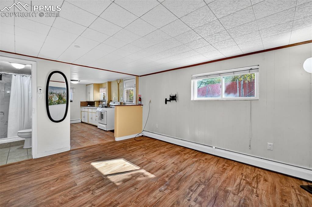 Image 28 of 46: ADU Living Room looking towards kitchen and bathroom in Basement