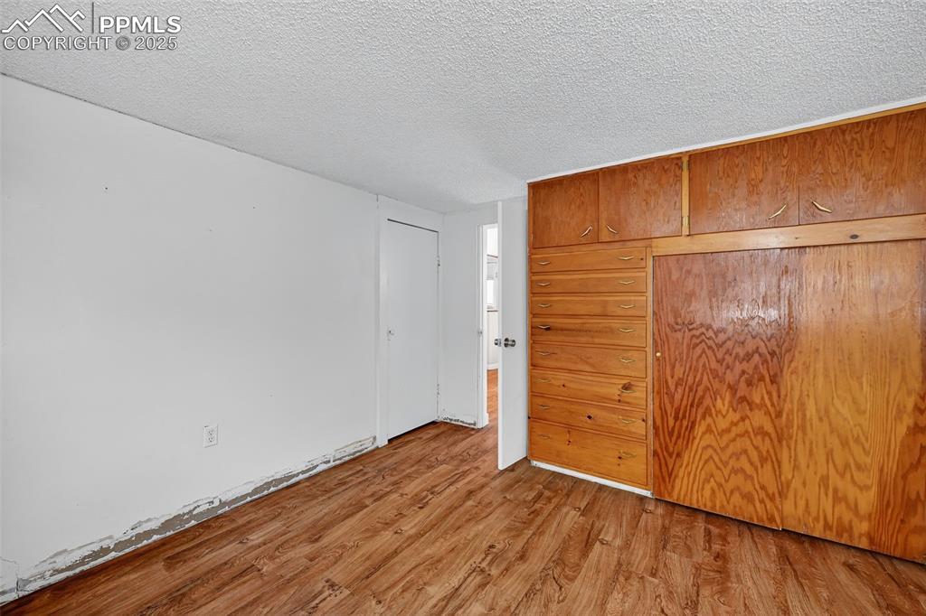 Image 32 of 46: ADU 4th Bedroom with builtins in Basement