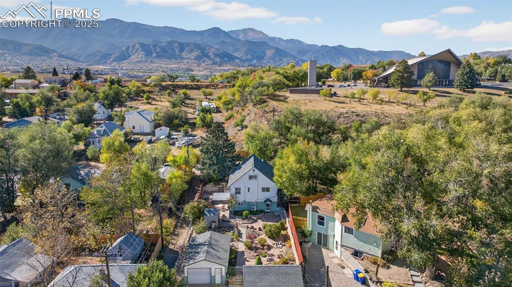 Image 42 of 46: Back aerial view of home looking West towards mountains