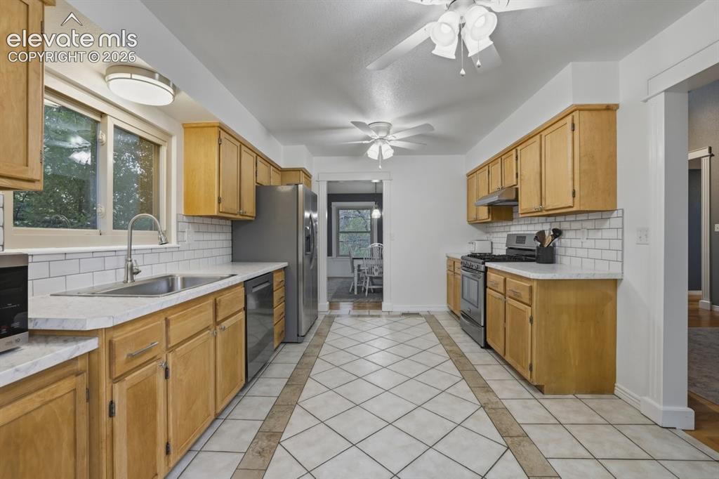 Image 12 of 45: large kitchen leads to the dining room