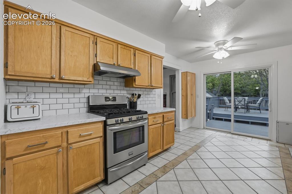 Image 13 of 45: stainless steel appliances and gas stove