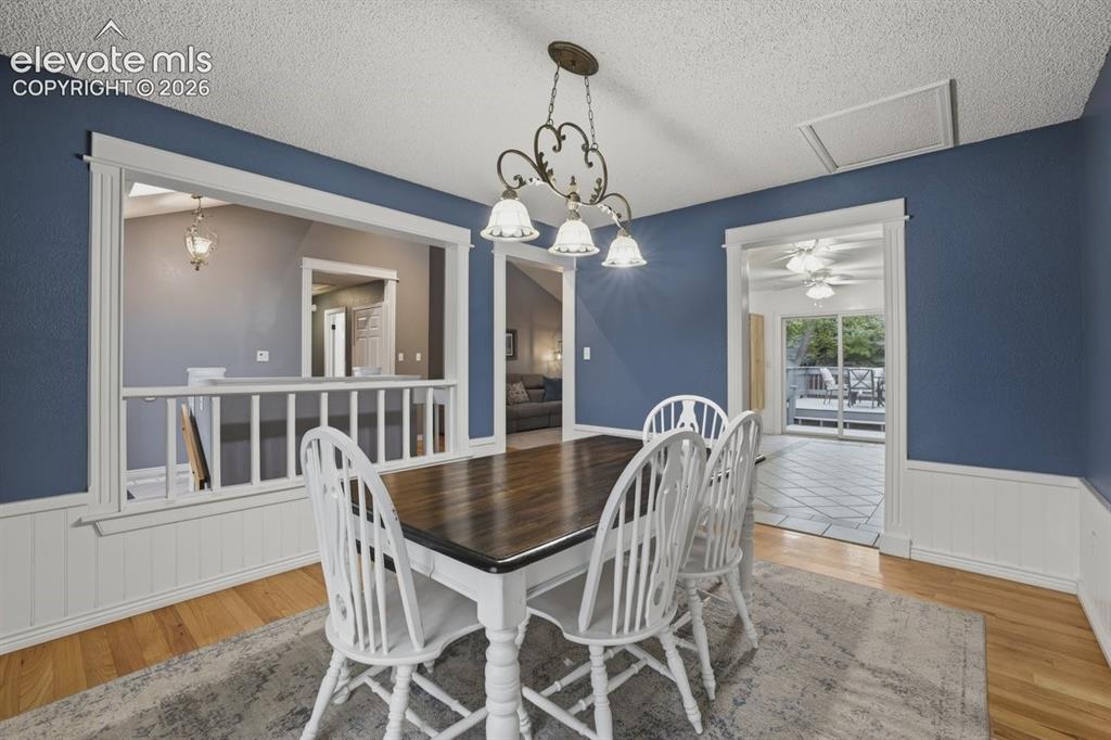Image 15 of 45: dining area overlooks the foyer and living room