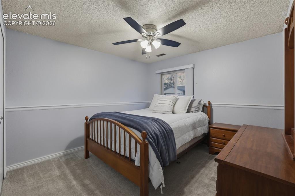 Image 30 of 45: Bedroom #4 in the lower level - garden level which offers good natural ligh