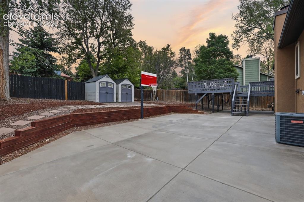 Image 42 of 45: great big patio space and 2 sheds for storage