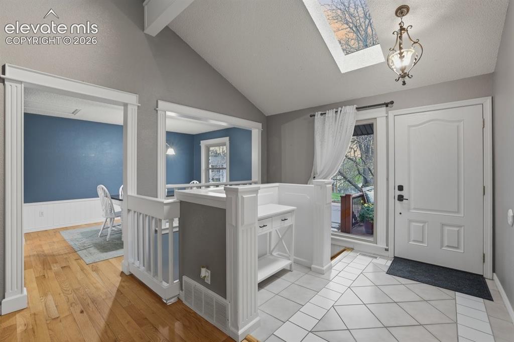 Image 7 of 45: vaulted ceiling with skylight
