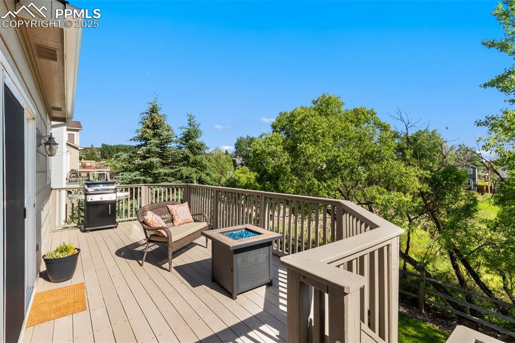 Image 36 of 44: Rear deck built for entertaining and enjoying the views of mountains and op