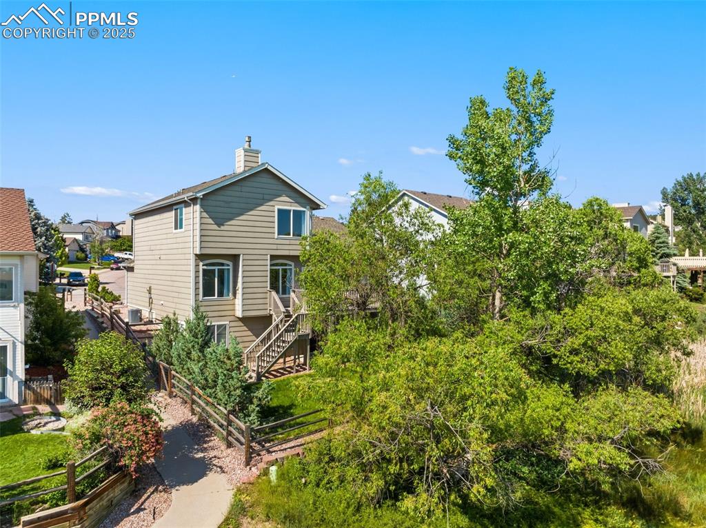 Image 40 of 44: Property borders open space and a walking trail.