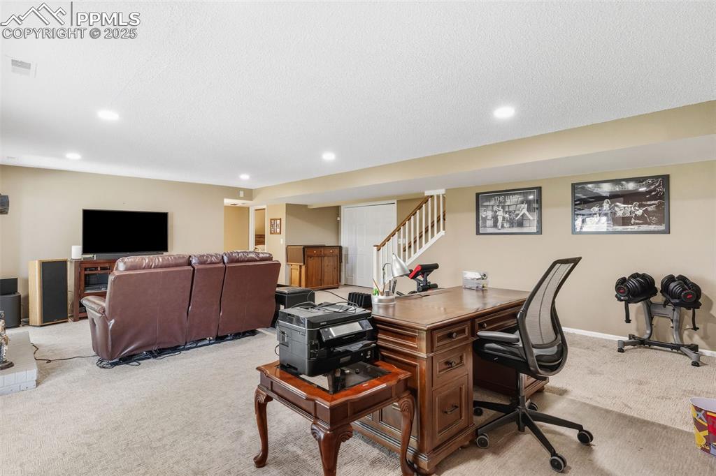 Image 17 of 35: Huge lower level family room with space for an office