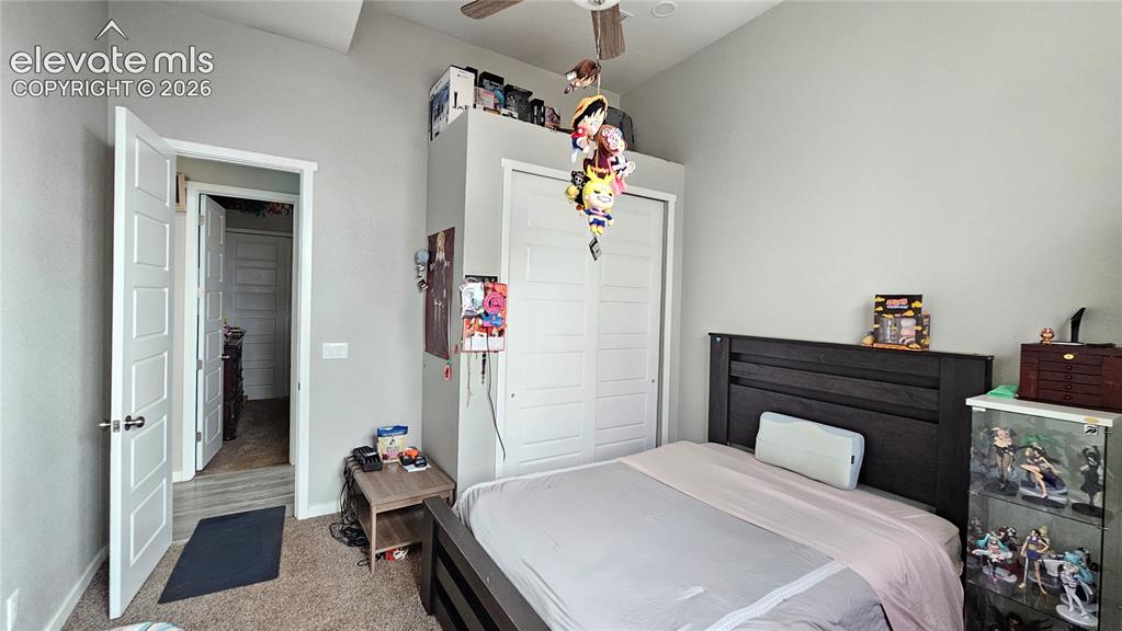 Image 21 of 48: Bedroom featuring a vaulted ceiling and a ceiling fan