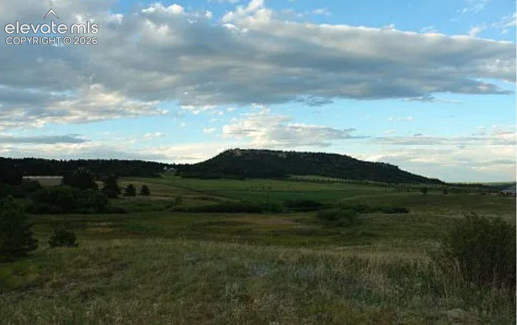 Image 2 of 32: View of mountain background with rural landscape
