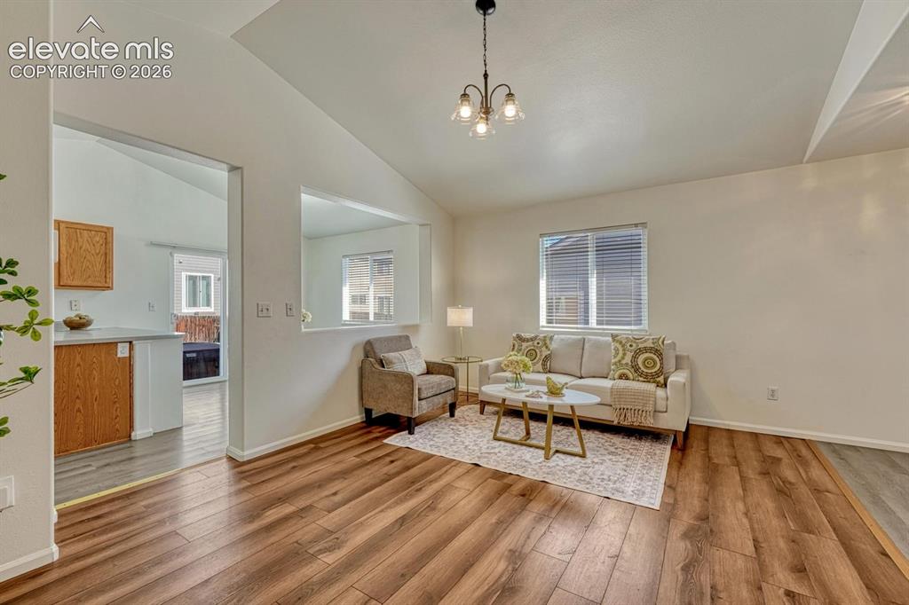 Image 14 of 35: View into the Kitchen and Dining Area from the Living Room.