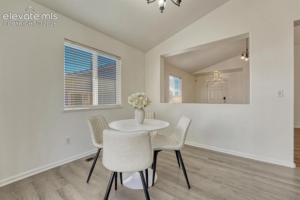 Image 18 of 35: Light and bright Dining Area with view into the Living Room.