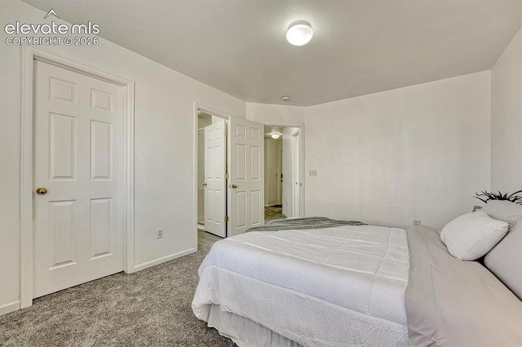 Image 26 of 35: The Primary Bedroom offers a generous walk in closet and adjoining Shower B