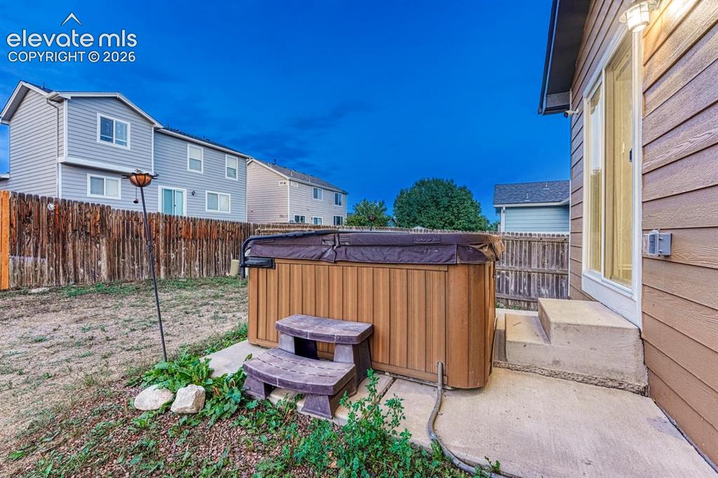 Image 6 of 35: Backyard patio (hot tub has been removed)