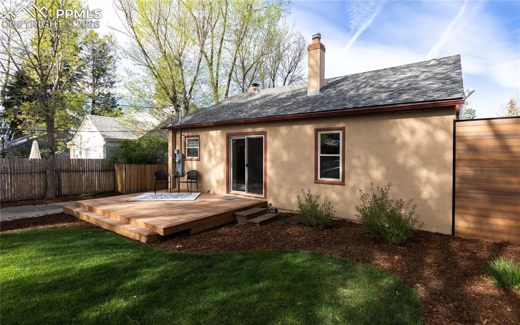 Image 26 of 29: New deck, brick pathways, garden beds