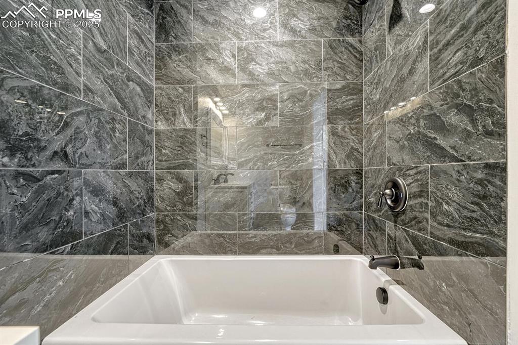 Image 21 of 50: Full bathroom featuring bathing tub / shower combination