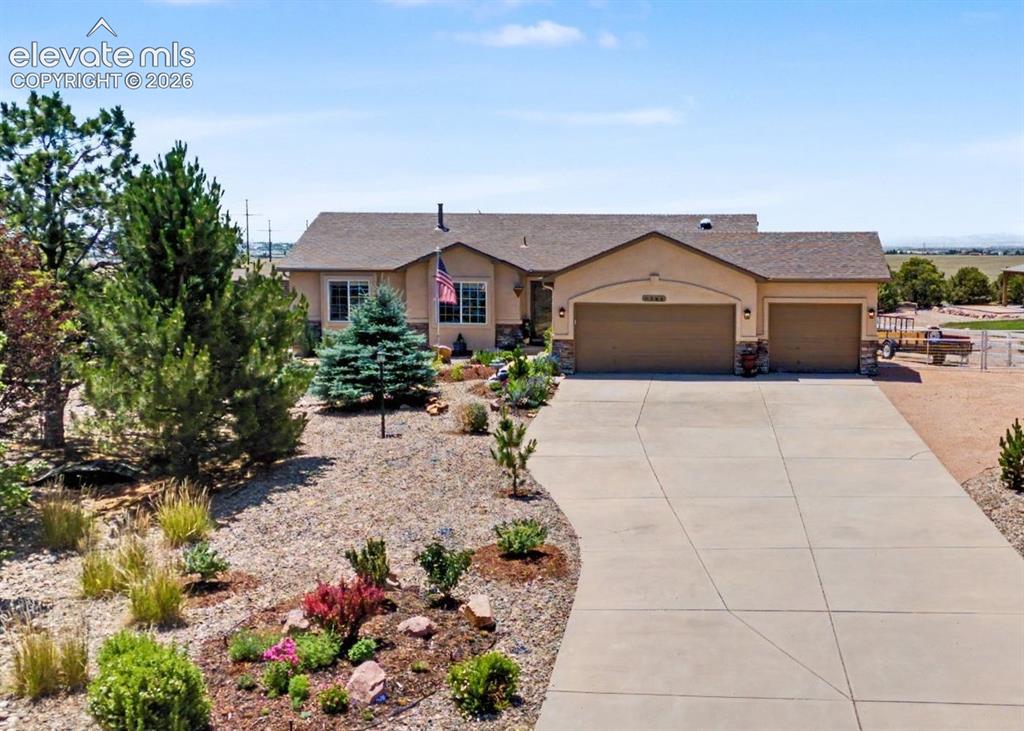 Image 1 of 43: Stunning Ranch Home with Beautiful Landscaping, Vibrant Perennial Flowers, 