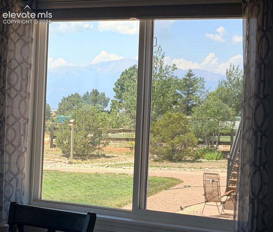 Image 10 of 43: View of Pikes Peak from Dining Room