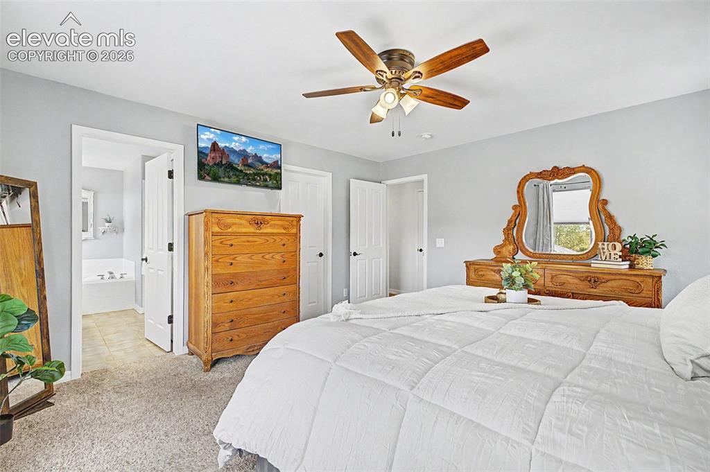 Image 16 of 43: Primary Bedroom has Ensuite Bathroom & Walk-in Closet
