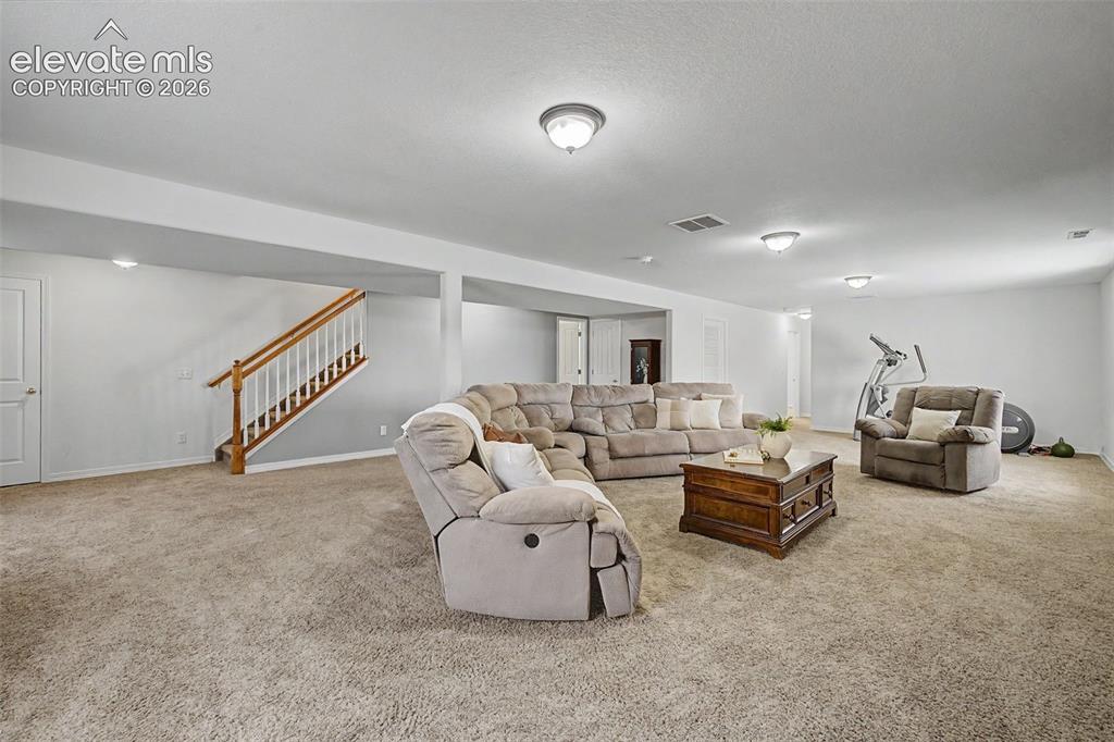 Image 24 of 43: Large Family/Rec Room in Basement