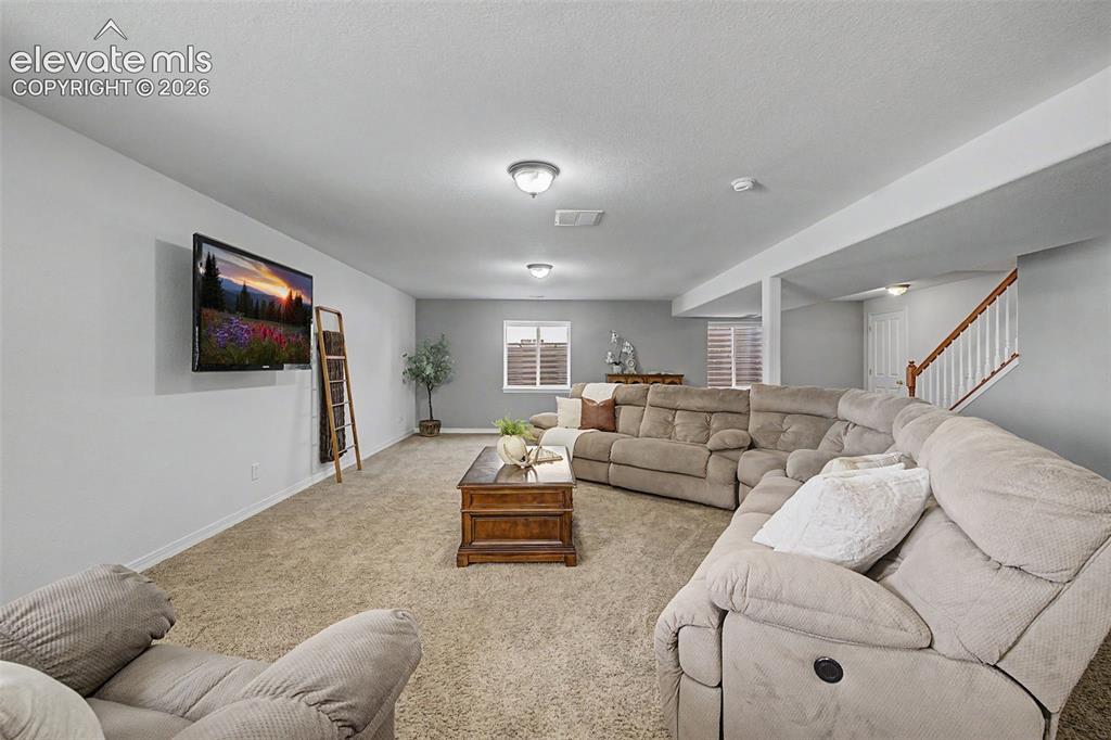 Image 26 of 43: Large Family/Rec Room in Basement
