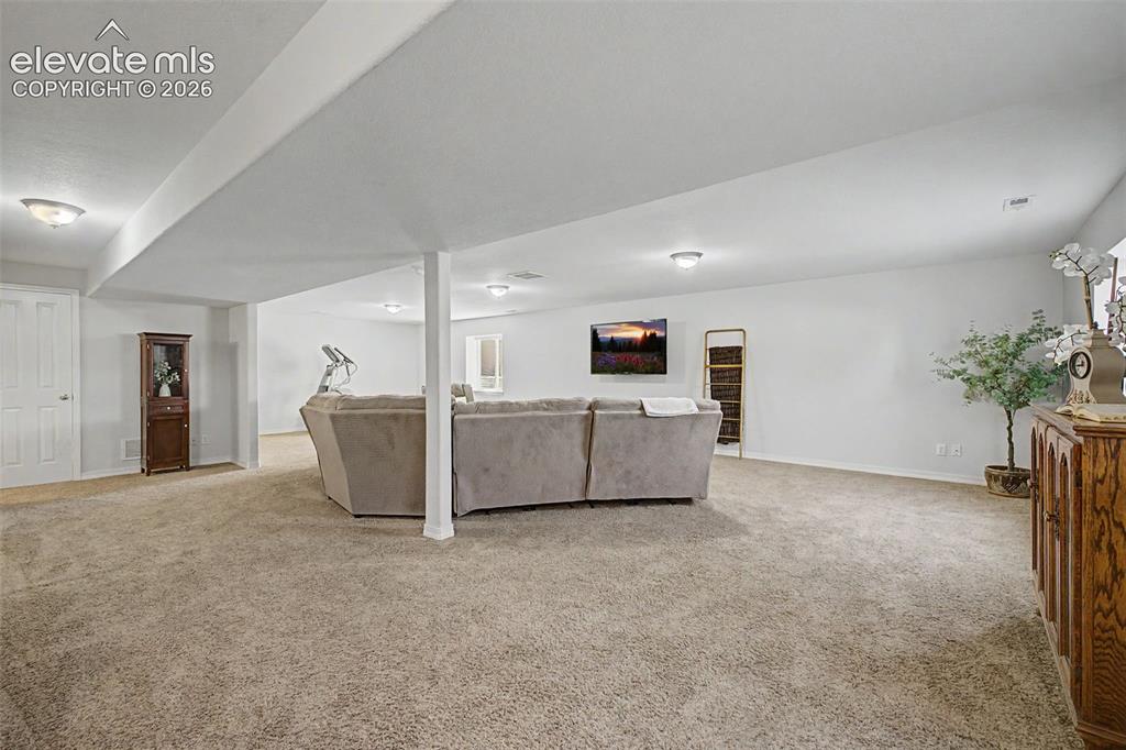 Image 27 of 43: Large Family/Rec Room in Basement