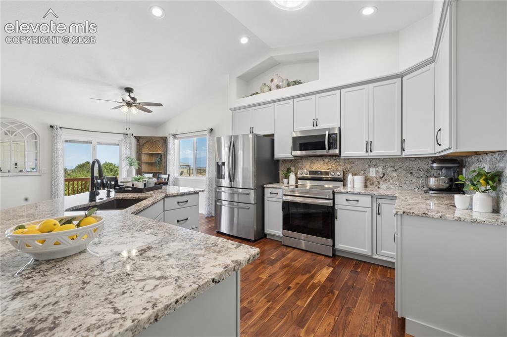 Image 3 of 43: Gorgeous Updated Kitchen with Granite Countertops & Backsplash and Mountain