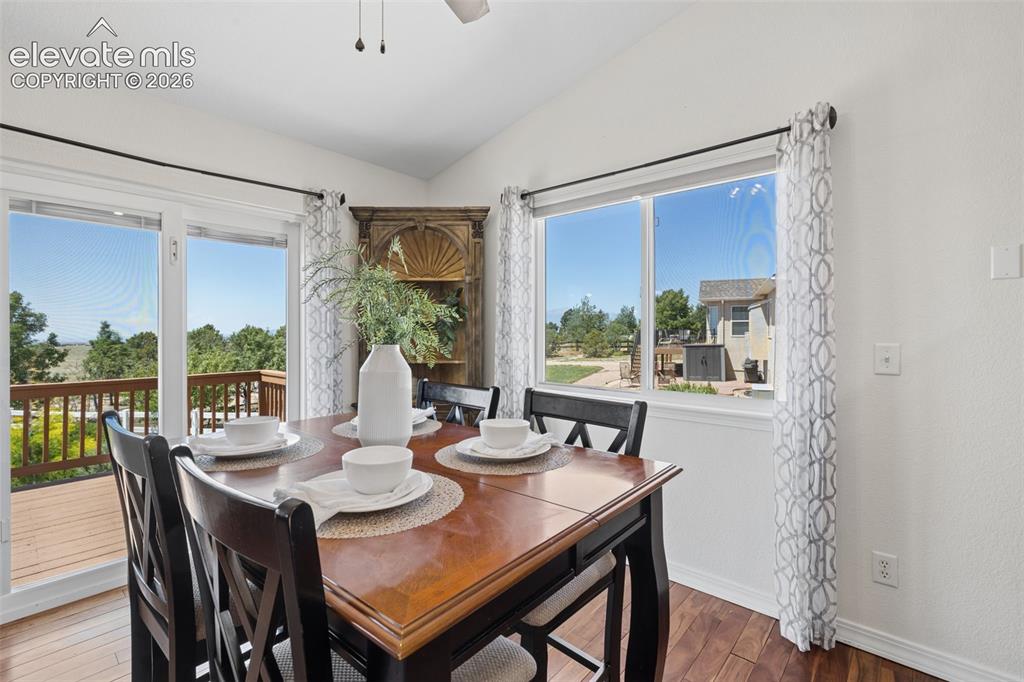 Image 9 of 43: Dining Room with Mountain Views & Opens to Deck