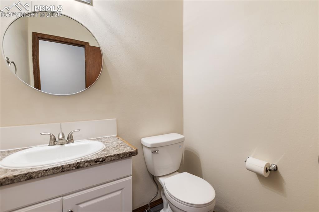 Image 20 of 27: The bathroom with a vanity and a toilet!