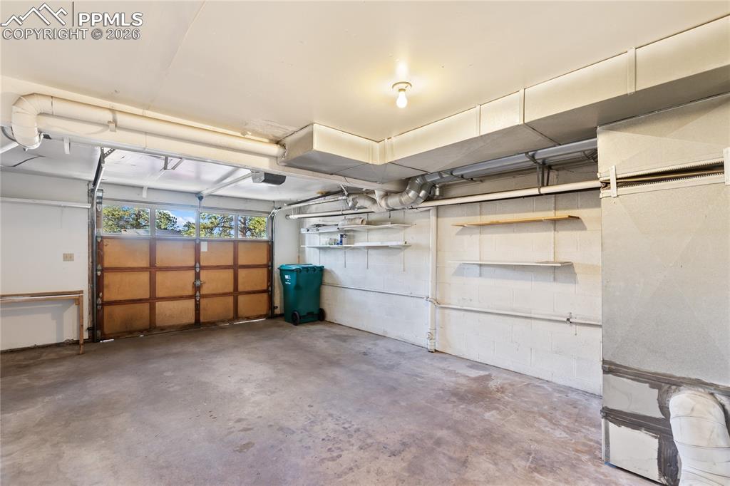 Image 22 of 27: The one-car garage!