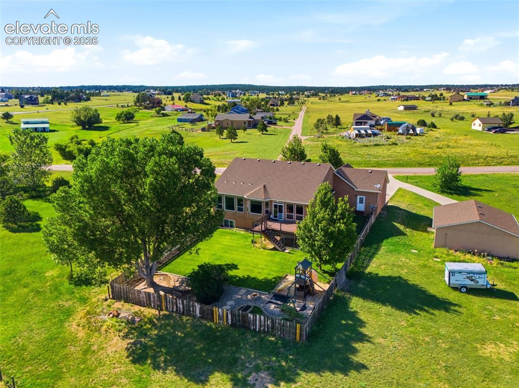 Image 36 of 48: Backyard is fenced & acreage is perimeter fenced