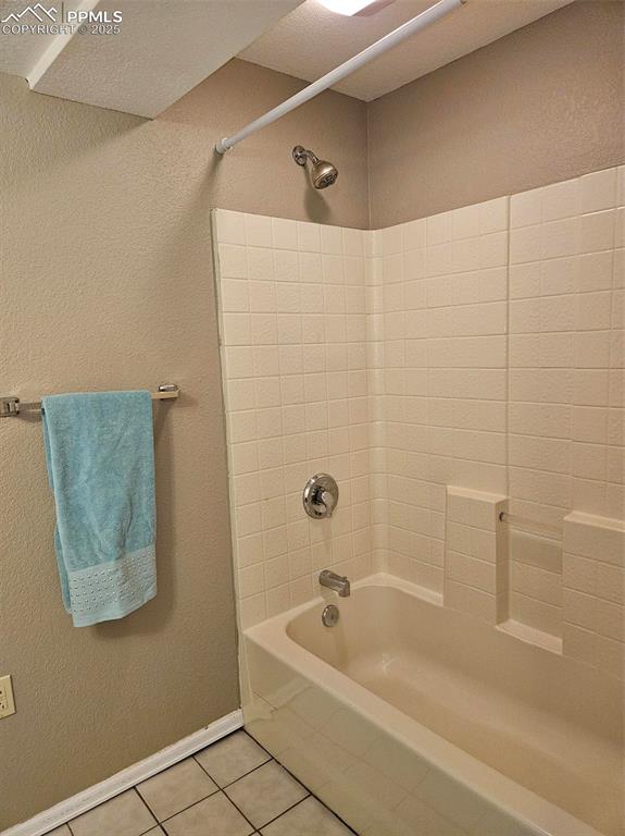 Image 20 of 27: Basement full bathroom tub