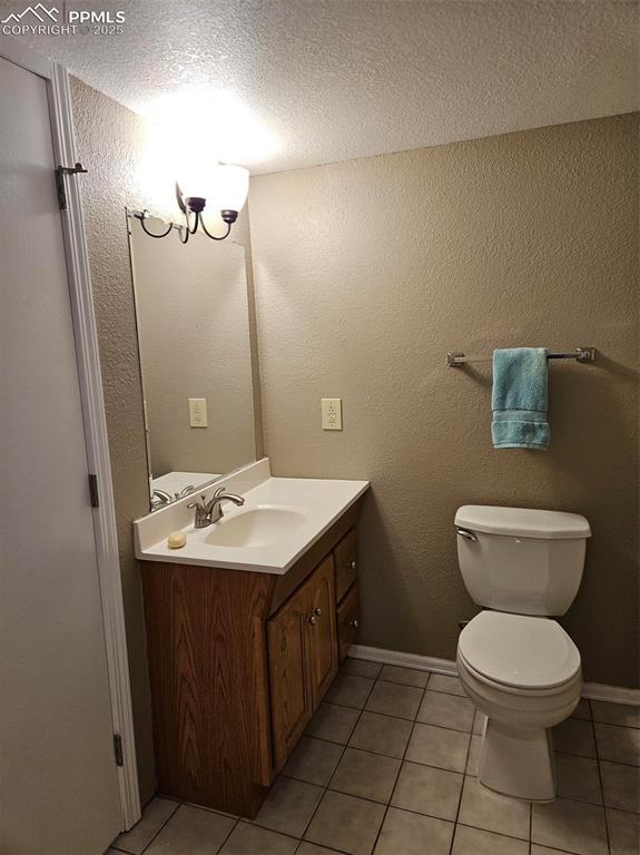 Image 21 of 27: Basement full bath vanity and toilet