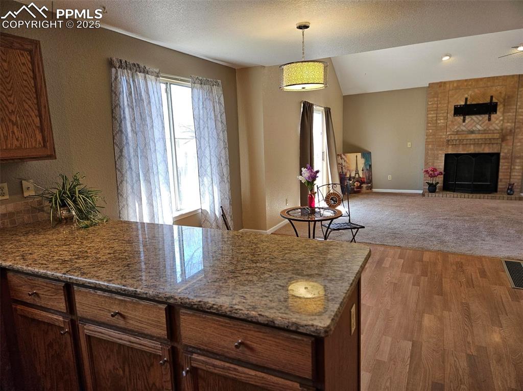 Image 7 of 27: Kitchen view to dining and living room