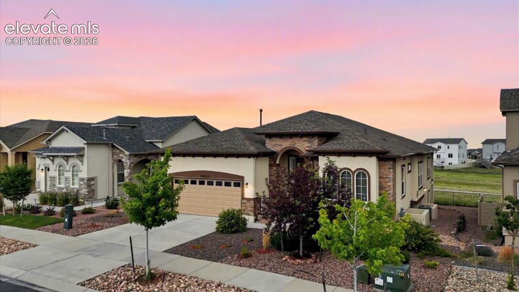 Image 1 of 50: Beautiful stucco/stone rancher located in Stonebridge at Meridian Ranch, of