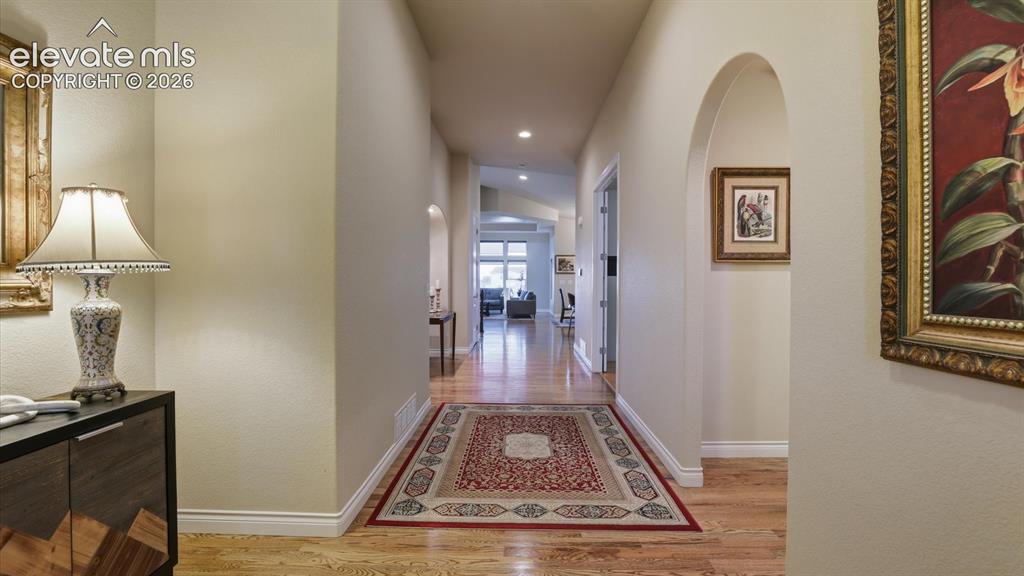 Image 11 of 50: Front Entry with gleaming wood floors.