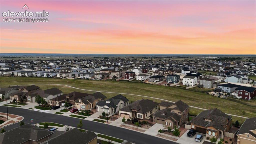 Image 2 of 50: Aerial view of home that backs to open space with walking/biking trails.