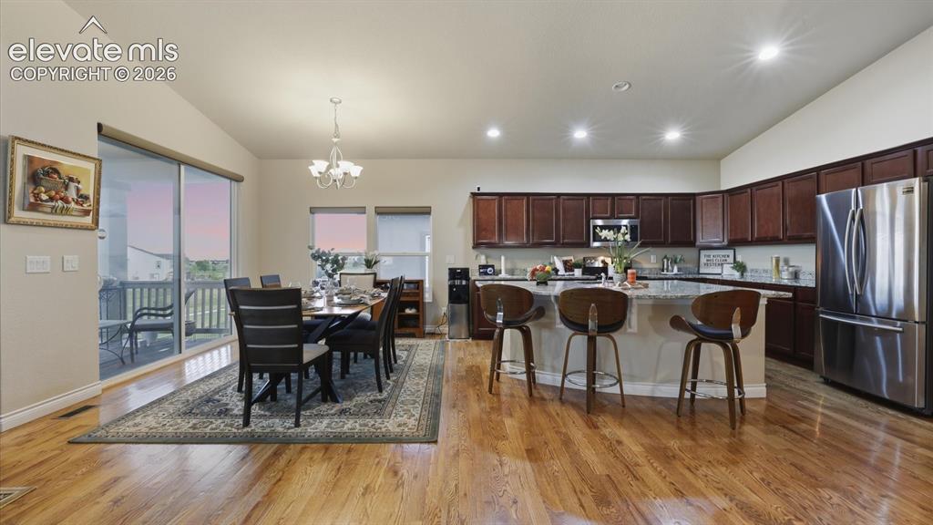 Image 24 of 50: The Dining Area is located off the Kitchen, making it easy for food service