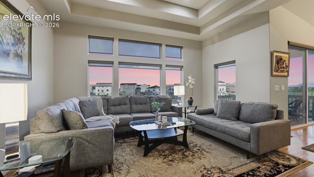 Image 27 of 50: The Living Room opens to the Dining Area and sliding door to the backyard d