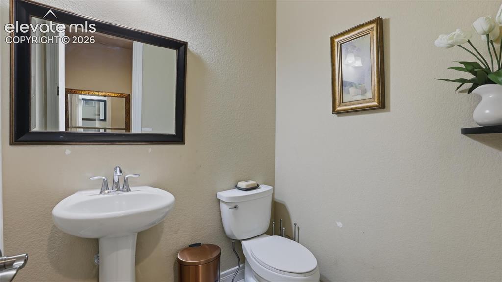 Image 36 of 50: Convenient Powder Bathroom for guests.