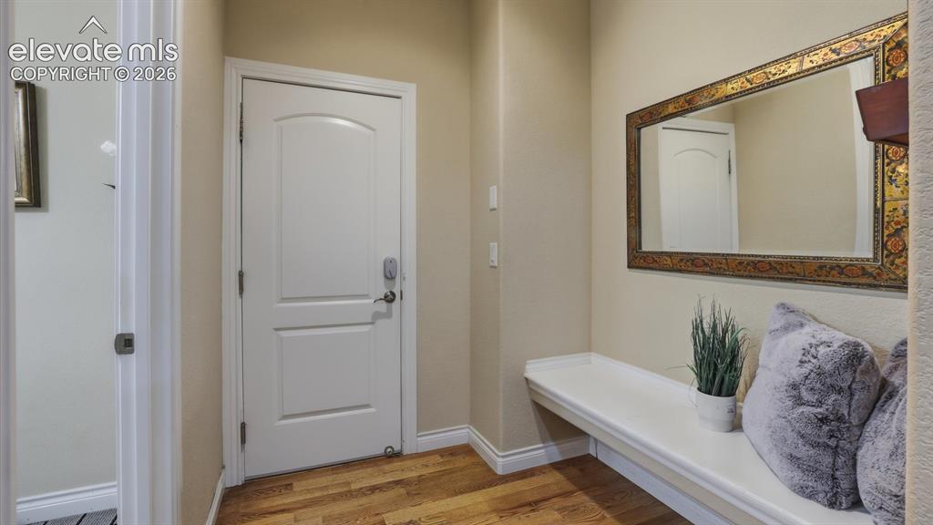 Image 37 of 50: Mud Room with built-in seat and access to the garage.
