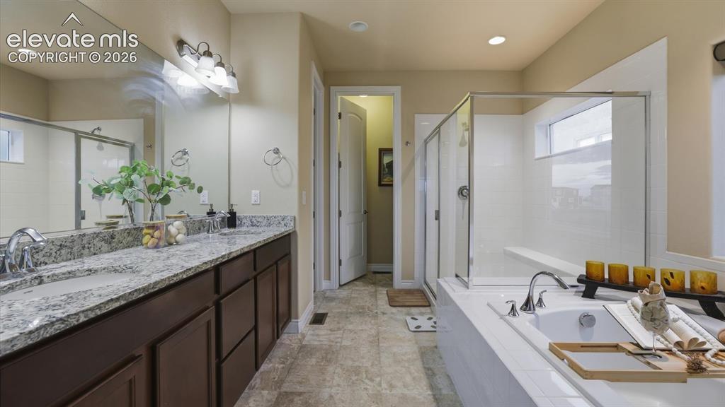 Image 7 of 50: 5pc Primary Bathroom with dual sink vanity, mirror, soaking tub, and separa