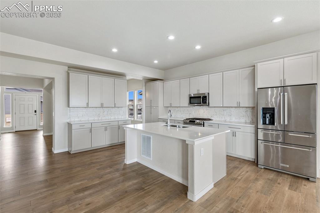 Image 13 of 46: Stylish kitchen with sleek cabinetry design