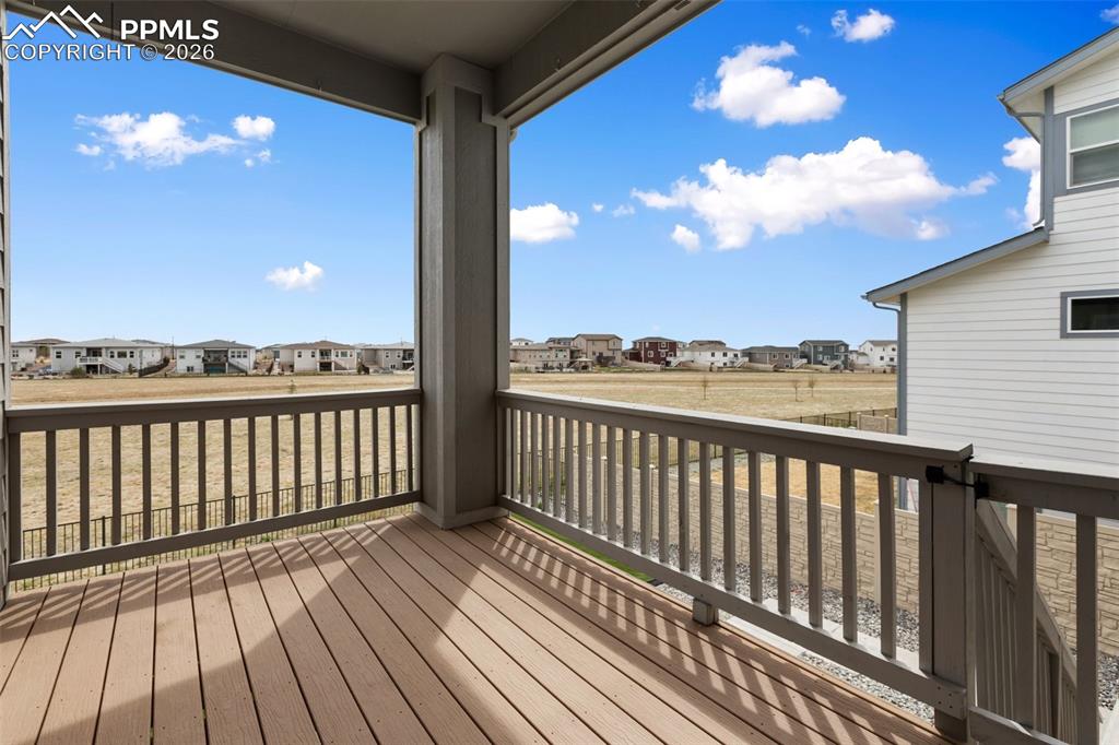 Image 14 of 46: Elevated deck with open backyard views